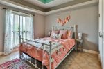Front bedroom with queen bed and beautiful antique touches